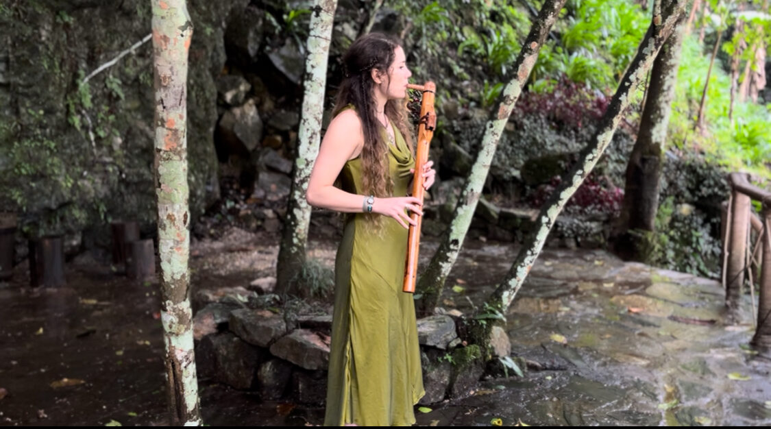 Performance in a tropical jungle by a stream