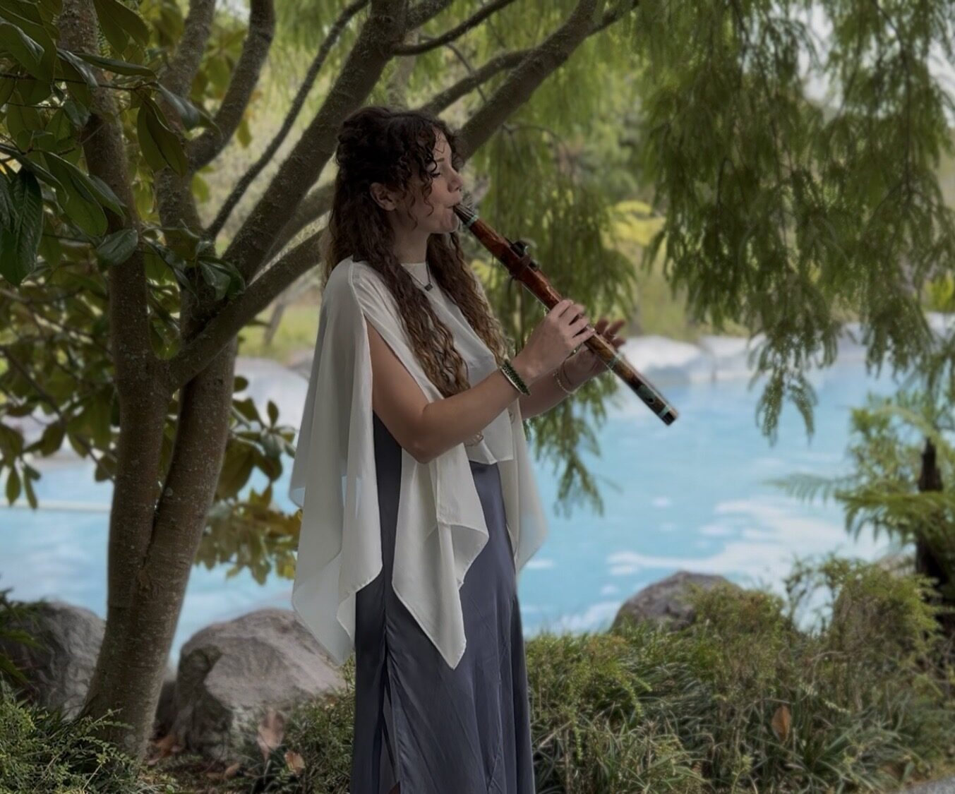 Performance at a tropical resort by the water